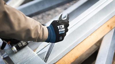 Retail specialist arranging window hardware displays in a showroom